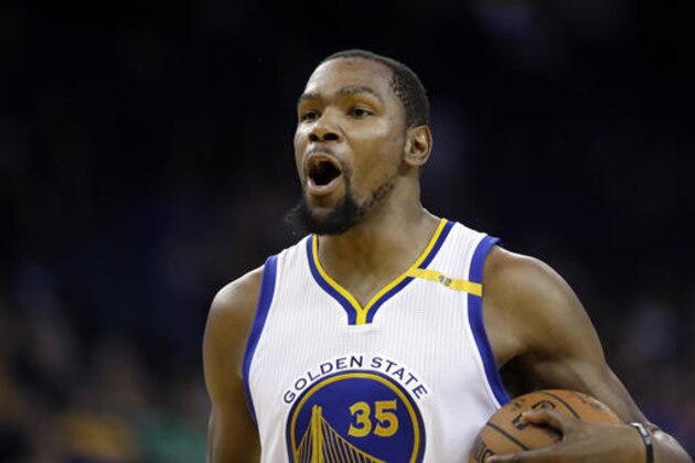 Golden State Warriors' Kevin Durant (35) reacts to a foul call during the second half of an NBA basketball game against the Miami Heat Tuesday, Jan. 10, 2017, in Oakland, Calif. (AP Photo/Marcio Jose Sanchez)