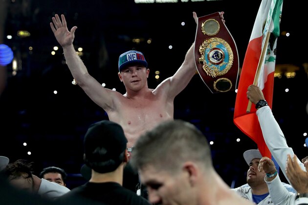 ARLINGTON, TX - SEPTEMBER 17: Canelo Alvarez celebrates after knocking out Liam Smith, lower, during the WBO Junior Middleweight World fight at AT&T Stadium on September 17, 2016 in Arlington, Texas. (Photo by Ronald Martinez/Getty Images) ARLINGTON, TX - SEPTEMBER 17: Canelo Alvarez celebrates after knocking out Liam Smith, lower, during the WBO Junior Middleweight World fight at AT&T Stadium on September 17, 2016 in Arlington, Texas. (Photo by Ronald Martinez/Getty Images)