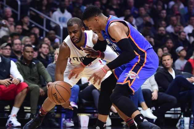 LOS ANGELES, CA - JANUARY 16:  Chris Paul #3 of the LA Clippers knocks the ball away from Russell Westbrook #0 of the Oklahoma City Thunder during the first half at Staples Center on January 16, 2017 in Los Angeles, California.  NOTE TO USER: User expressly acknowledges and agrees that, by downloading and or using this photograph, User is consenting to the terms and conditions of the Getty Images License Agreement.  (Photo by Harry How/Getty Images)