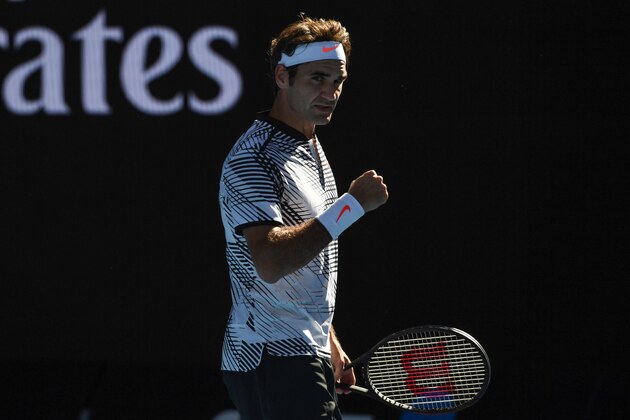 Switzerland's Roger Federer reacts after a point against Noah Rubin of the US during their men's singles match on day three of the Australian Open tennis tournament in Melbourne on January 18, 2017. / AFP / SAEED KHAN / IMAGE RESTRICTED TO EDITORIAL USE - STRICTLY NO COMMERCIAL USE        (Photo credit should read SAEED KHAN/AFP/Getty Images)