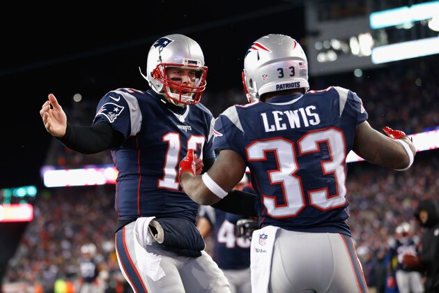 FOXBORO, MA - JANUARY 14: Dion Lewis #33 celebrates with Tom Brady #12 of the New England Patriots after scoring a touchdown in the fourth quarter during the AFC Divisional Playoff Game at Gillette Stadium on January 14, 2017 in Foxboro, Massachusetts.  (Photo by Jim Rogash/Getty Images)