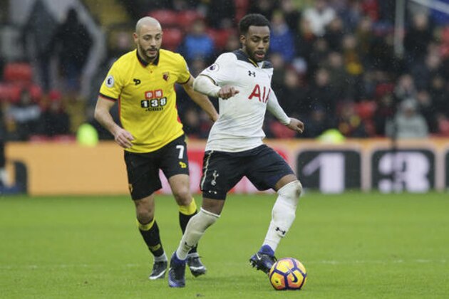 Tottenham's Danny Rose, right, competes for the ball with Watford's Nordin Amrabat during the English Premier League soccer match between Watford and Tottenham Hotspur at the Vicarage Road Stadium in Watford, England Sunday Jan. 1, 2017. (AP Photo/Tim Ireland)