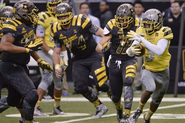 West's Jack Jones, right, evades East defenders during the second half of the Army All American Bowl high school football game, Saturday, Jan. 9, 2016, in San Antonio. West won 37-9. (AP Photo/Darren Abate)