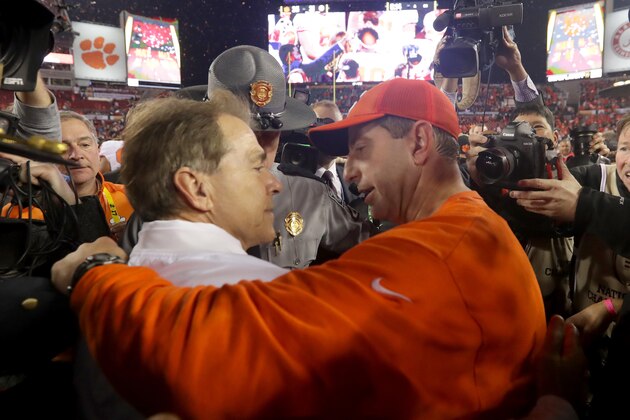 TAMPA, FL - JANUARY 09:  Head coach Nick Saban of the Alabama Crimson Tide talks with head coach Dabo Swinney of the Clemson Tigers after the Tigers defeated the Crimson Tide 35-31 in the 2017 College Football Playoff National Championship Game at Raymond James Stadium on January 9, 2017 in Tampa, Florida.  (Photo by Streeter Lecka/Getty Images)