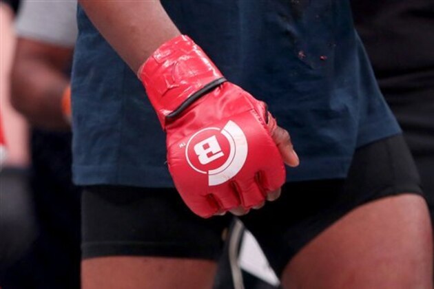 A closeup of the Bellator logo on a glow at Bellator 134 on Friday, Feb. 27, 2015, in Uncasville, CT.  (AP Photo/Gregory Payan)