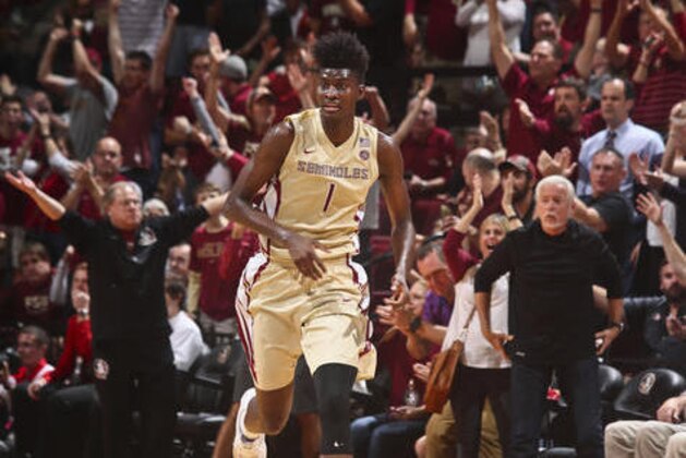 Florida State fans cheer for forward Jonathan Isaac (1), who led the game with 23 points and 7 blocks, after he made a three-point shot late in the second half of an NCAA college basketball game against Notre Dame on Wednesday, Jan. 18, 2017, in Tallahassee, Fla. Florida State won 83-80. (AP Photo/Phil Sears)
