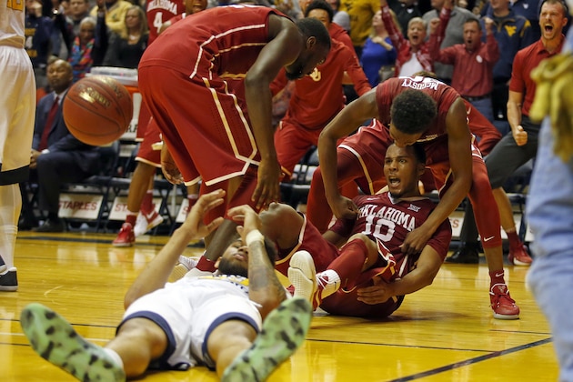 MORGANTOWN, WV - JANUARY 18:  Jordan Woodard #10 of the Oklahoma Sooners reacts after making the shot and a foul against Esa Ahmad #23 of the West Virginia Mountaineers at the WVU Coliseum on January 18, 2017 in Morgantown, West Virginia.  (Photo by Justin K. Aller/Getty Images)