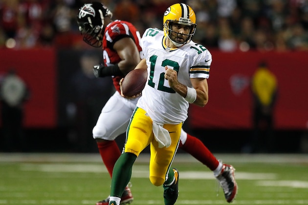 ATLANTA, GA - OCTOBER 30:  Aaron Rodgers #12 of the Green Bay Packers rushes awau Dwight Freeney #93 of the Atlanta Falcons at Georgia Dome on October 30, 2016 in Atlanta, Georgia.  (Photo by Kevin C. Cox/Getty Images)