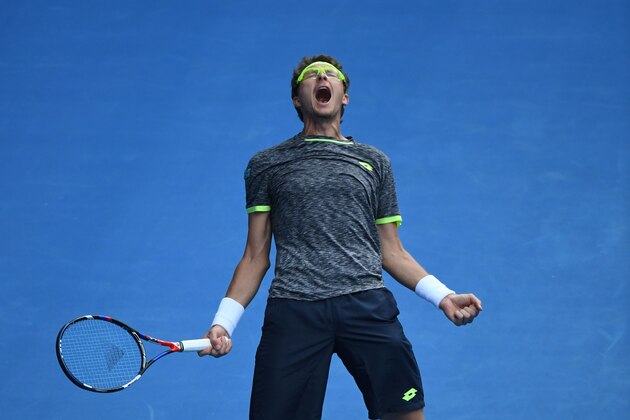 Uzbekistan's Denis Istomin celebrates his win against Serbia's Novak Djokovic during their men's singles second round match on day four of the Australian Open tennis tournament in Melbourne on January 19, 2017. / AFP / SAEED KHAN / IMAGE RESTRICTED TO EDITORIAL USE - STRICTLY NO COMMERCIAL USE        (Photo credit should read SAEED KHAN/AFP/Getty Images)