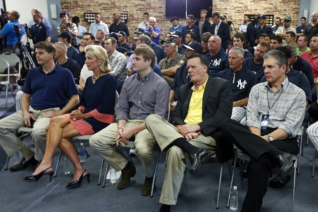 TAMPA, FL - FEBRUARY 19:  Members of the New York Yankees management (L-R) Hal Steinbrenner, Jennifer Steinbrenner Swindal, Stephen Swindal Jr., and Hank Steinbrenner are joined by agent Casey Close as they listen to Derek Jeter speaking at a media availability after announcing that the 2014 season will be his last before retiring at George M. Steinbrenner Field on February 19, 2014 in Tampa, Florida. (Photo by Mike Carlson/Getty Images)
