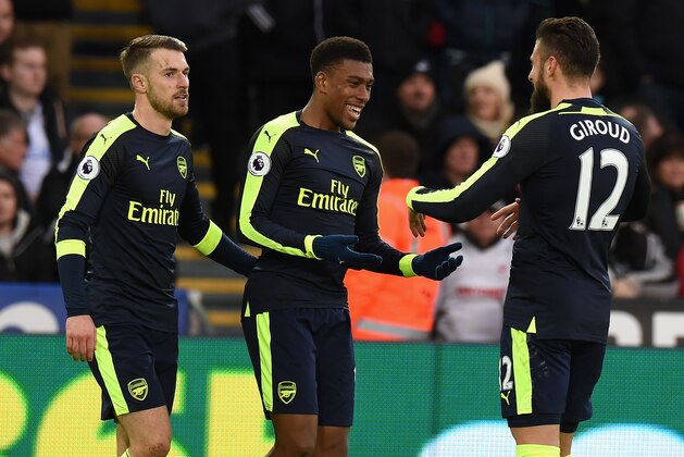 SWANSEA, WALES - JANUARY 14: Alex Iwobi of Arsenal celebrates scoring thier second goal with Olivier Giroud of Arsenal during the Premier League match between Swansea City and Arsenal at Liberty Stadium on January 14, 2017 in Swansea, Wales. (Photo by Tony Marshall/Getty Images) SWANSEA, WALES - JANUARY 14: Alex Iwobi of Arsenal celebrates scoring thier second goal with Olivier Giroud of Arsenal during the Premier League match between Swansea City and Arsenal at Liberty Stadium on January 14, 2017 in Swansea, Wales. (Photo by Tony Marshall/Getty Images)