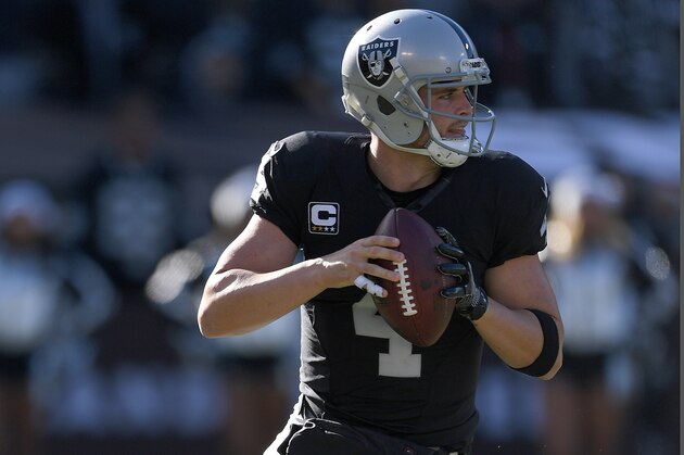 OAKLAND, CA - DECEMBER 24:  Derek Carr #4 of the Oakland Raiders rolls out to pass against the Indianapolis Colts during the first quarter of their NFL football game at the Oakland-Alameda County Coliseum on December 24, 2016 in Oakland, California.  (Photo by Thearon W. Henderson/Getty Images)