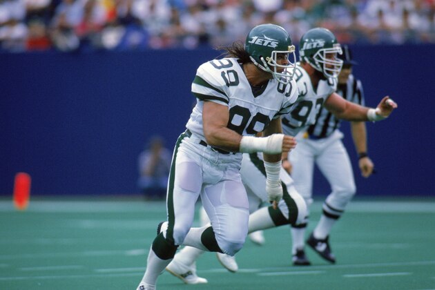 MEADOWLANDS - SEPTEMBER 18:  Defensive end Mark Gastineau #99 of the New York Jets runs on the field during a game against the Houston Oilers on September 18, 1988 at Giants Stadium in the Meadowlands, East Rutherford, New Jersey.  (Photo by Rick Stewart/Getty Images)