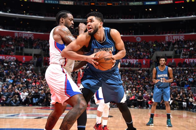 LOS ANGELES, CA - JANUARY 19: Karl-Anthony Towns #32 of the Minnesota Timberwolves handles the ball during the game against DeAndre Jordan #6 of the Los Angeles Clippers on January 19, 2017 at STAPLES Center in Los Angeles, California. NOTE TO USER: User expressly acknowledges and agrees that, by downloading and/or using this Photograph, user is consenting to the terms and conditions of the Getty Images License Agreement. Mandatory Copyright Notice: Copyright 2017 NBAE (Photo by Andrew D. Bernstein/NBAE via Getty Images)