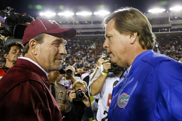 TALLAHASSEE, FL - NOVEMBER 26: Head Coach Jimbo Fisher of the Florida State Seminoles talk with Head Coach Jim McElwain of the Florida Gators before the game at Doak Campbell Stadium on Bobby Bowden Field on November 26, 2016 in Tallahassee, Florida. The 14th ranked Florida Seminoles defeated the 15th ranked Florida Gators 31 to 13. (Photo by Don Juan Moore/Getty Images) TALLAHASSEE, FL - NOVEMBER 26: Head Coach Jimbo Fisher of the Florida State Seminoles talk with Head Coach Jim McElwain of the Florida Gators before the game at Doak Campbell Stadium on Bobby Bowden Field on November 26, 2016 in Tallahassee, Florida. The 14th ranked Florida Seminoles defeated the 15th ranked Florida Gators 31 to 13. (Photo by Don Juan Moore/Getty Images)