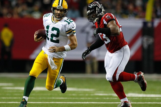 ATLANTA, GA - OCTOBER 30:  Aaron Rodgers #12 of the Green Bay Packers rushes past Dwight Freeney #93 of the Atlanta Falcons at Georgia Dome on October 30, 2016 in Atlanta, Georgia.  (Photo by Kevin C. Cox/Getty Images)