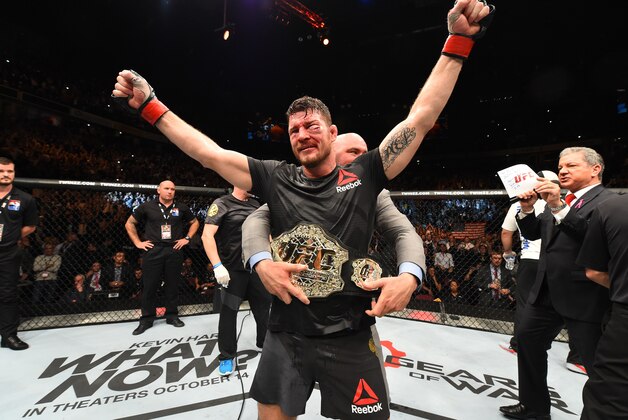 MANCHESTER, ENGLAND - OCTOBER 08:  Michael Bisping of England celebrates his victory over Dan Henderson in their UFC middleweight championship bout during the UFC 204 Fight Night at the Manchester Evening News Arena on October 8, 2016 in Manchester, England. (Photo by Josh Hedges/Zuffa LLC/Zuffa LLC via Getty Images)