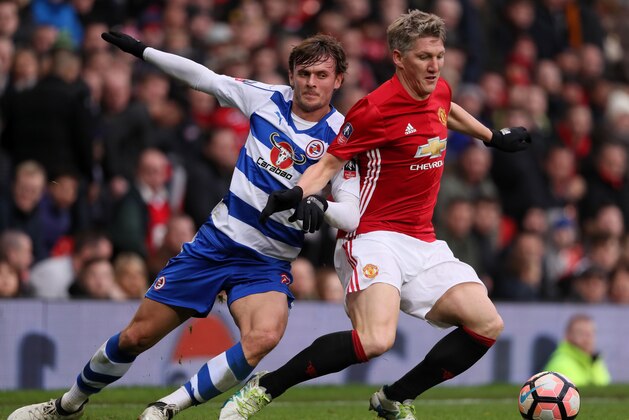 MANCHESTER, ENGLAND - JANUARY 07:  John Swift of Reading battles with Bastian Schweinsteiger of Manchester United during the Emirates FA Cup third round match between Manchester United and Reading at Old Trafford on January 7, 2017 in Manchester, England.  (Photo by Matthew Ashton - AMA/Getty Images)