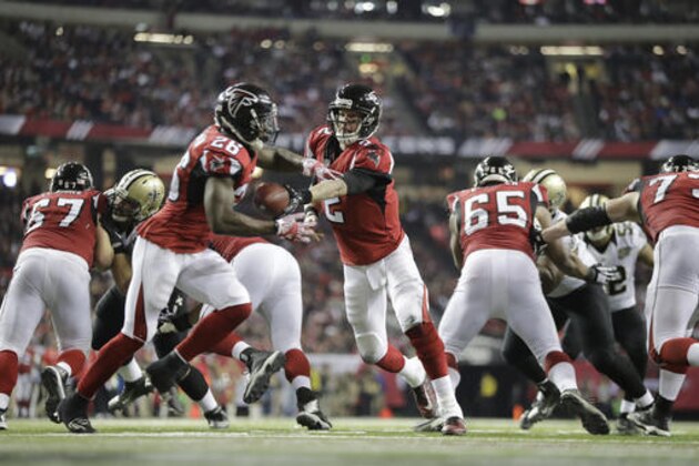Atlanta Falcons quarterback Matt Ryan (2) hands the ball to Atlanta Falcons running back Tevin Coleman (26) against the New Orleans Saints during the second half of an NFL football game, Sunday, Jan. 1, 2017, in Atlanta. (AP Photo/David Goldman)