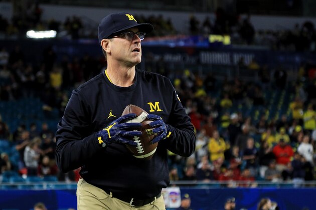 MIAMI GARDENS, FL - DECEMBER 30: Head coach Jim Harbaugh of the Michigan Wolverines looks on prior to their Capitol One Orange Bowl game against the Florida State Seminoles at Sun Life Stadium on December 30, 2016 in Miami Gardens, Florida. (Photo by Mike Ehrmann/Getty Images) MIAMI GARDENS, FL - DECEMBER 30: Head coach Jim Harbaugh of the Michigan Wolverines looks on prior to their Capitol One Orange Bowl game against the Florida State Seminoles at Sun Life Stadium on December 30, 2016 in Miami Gardens, Florida. (Photo by Mike Ehrmann/Getty Images)