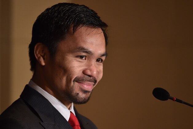 WBO welterweight world champion Manny Pacquiao attends a press conference at the Foreign Correspondents' Club of Japan prior to his press conference in Tokyo on November 26, 2016.  
Pacquiao is in Japan to launch his first fitness gym 'PACQUIAO GYM TOKYO JAPAN' in Harajuku, Tokyo. / AFP / KAZUHIRO NOGI        (Photo credit should read KAZUHIRO NOGI/AFP/Getty Images)
