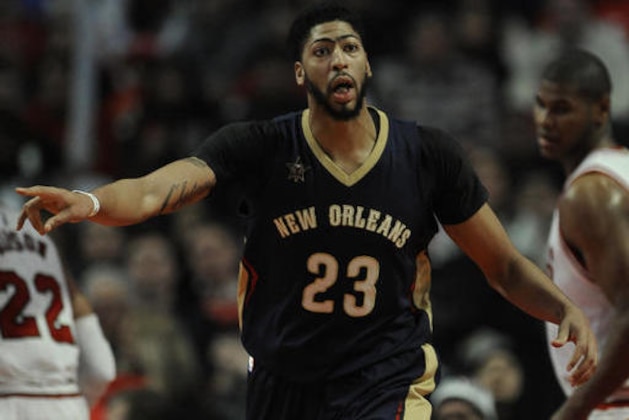 New Orleans Pelicans' Anthony Davis (23) yells to teammate E'Twaun Moore after making a basket during the second half of an NBA basketball game against the Chicago Bulls, Saturday, Jan. 14, 2017, in Chicago. (AP Photo/Paul Beaty)