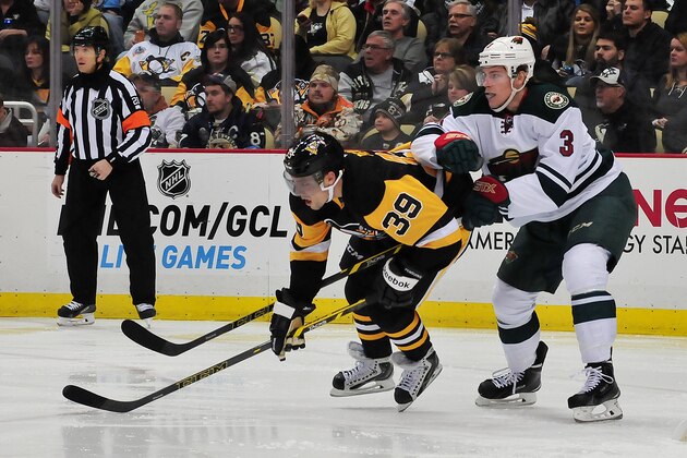PITTSBURGH, PA - JANUARY 13: Charlie Coyle #3 of the the Minnesota Wild knocks down David Perron #39 of the Pittsburgh Penguins during a game at Consol Energy Center on January 13, 2015 in Pittsburgh, Pennsylvania. The Penguins defeated the Wild 7-2. (Photo by Matt Kincaid/Getty Images)