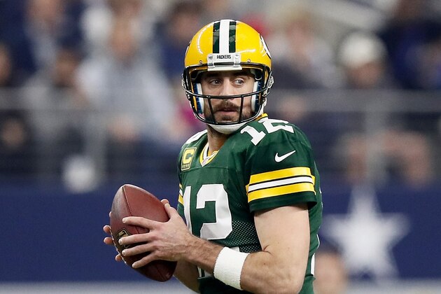 ARLINGTON, TX - JANUARY 15:  Aaron Rodgers #12 of the Green Bay Packers drops back to pass in the first half during the NFC Divisional Playoff Game against the Dallas Cowboys at AT&T Stadium on January 15, 2017 in Arlington, Texas.  (Photo by Ezra Shaw/Getty Images)
