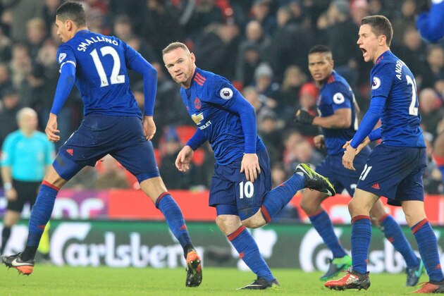 Manchester United's English striker Wayne Rooney (C) celebrates scoring his 250th goal to make him the club's all-time record goal scorerer in the English Premier League football match between Stoke City and Manchester United at the Bet365 Stadium in Stoke-on-Trent, central England on January 21, 2017. / AFP / Lindsey PARNABY / RESTRICTED TO EDITORIAL USE. No use with unauthorized audio, video, data, fixture lists, club/league logos or 'live' services. Online in-match use limited to 75 images, no video emulation. No use in betting, games or single club/league/player publications.  /         (Photo credit should read LINDSEY PARNABY/AFP/Getty Images)