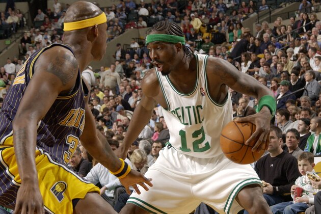 BOSTON - APRIL 23:  Ricky Davis #12 of the Boston Celtics handles the ball against Al Harrington #3 of the Indiana Pacers during Game three of the Eastern Conference Quarterfinals during the 2004 NBA Playoffs April 23, 2004 at the Fleet Center in Boston, Massachusetts.  NOTE TO USER: User expressly acknowledges and agrees that, by downloading and or using this photograph, user is consenting to the terms and conditions of the Getty Images License agreement.  (Photo by Brian Babineau/NBAE via Getty Images)