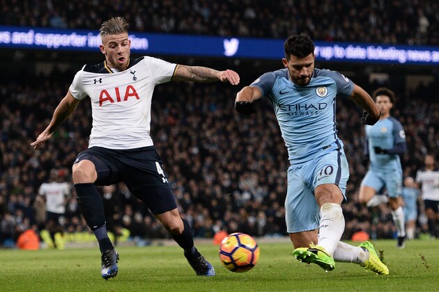 Manchester City's Argentinian striker Sergio Aguero (R) has an unsucessful shot under pressure from Tottenham Hotspur's Belgian defender Toby Alderweireld (L) during the English Premier League football match between Manchester City and Tottenham Hotspur at the Etihad Stadium in Manchester, north west England, on January 21, 2017. / AFP / Oli SCARFF / RESTRICTED TO EDITORIAL USE. No use with unauthorized audio, video, data, fixture lists, club/league logos or 'live' services. Online in-match use limited to 75 images, no video emulation. No use in betting, games or single club/league/player publications.  /         (Photo credit should read OLI SCARFF/AFP/Getty Images)