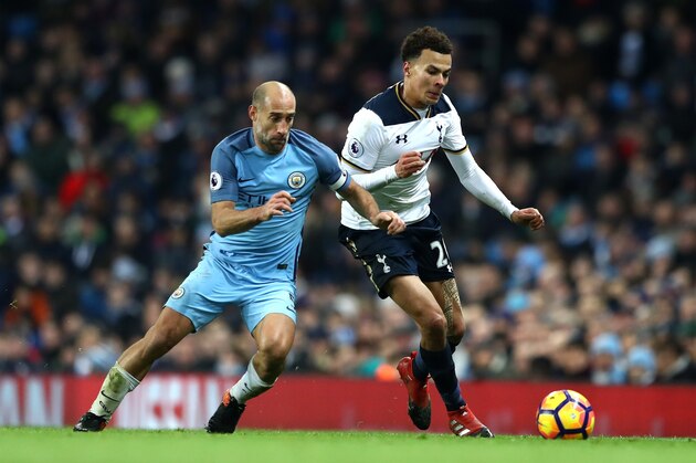MANCHESTER, ENGLAND - JANUARY 21:  Pablo Zabaleta of Manchester City (L) and Dele Alli of Tottenham Hotspur (R) battle for possession during the Premier League match between Manchester City and Tottenham Hotspur at the Etihad Stadium on January 21, 2017 in Manchester, England.  (Photo by Clive Mason/Getty Images)
