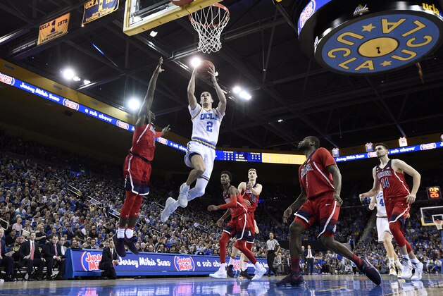 LOS ANGELES, CA - JANUARY 21: Lonzo Ball #2 of the UCLA Bruins scores a basket against Kadeem Allen #5 of the Arizona Wildcats during the first half of the game at Pauley Pavilion on January 21, 2017 in Los Angeles, California. (Photo by Kevork Djansezian/Getty Images)