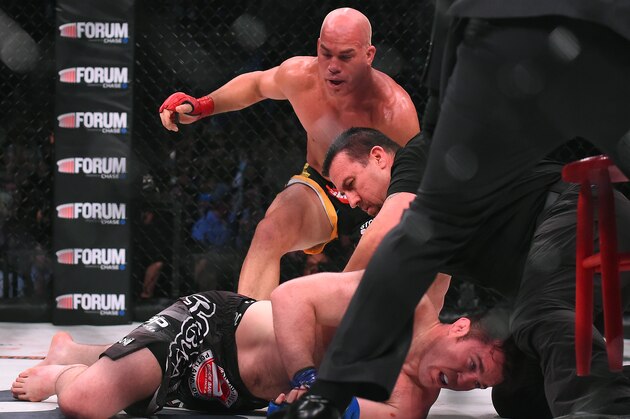 INGLEWOOD, CA - JANUARY 21:  Tito Ortiz (red gloves) reacts as referee John McCarthy checks on Chael Sonnen (blue gloves) after stopping their Bellator MMA light heavyweight fight in round one of at The Forum on January 21, 2017 in Inglewood, California. Ortiz won in the first round.  (Photo by Jayne Kamin-Oncea/Getty Images)