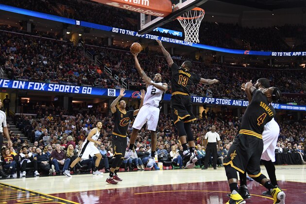 CLEVELAND, OH - JANUARY 21: Kawhi Leonard #2 of the San Antonio Spurs shoots over Tristan Thompson #13 of the Cleveland Cavaliers during the second half at Quicken Loans Arena on January 21, 2017 in Cleveland, Ohio. The Spurs defeated the Cavaliers 118-115. NOTE TO USER: User expressly acknowledges and agrees that, by downloading and/or using this photograph, user is consenting to the terms and conditions of the Getty Images License Agreement. Mandatory copyright notice. (Photo by Jason Miller/Getty Images)