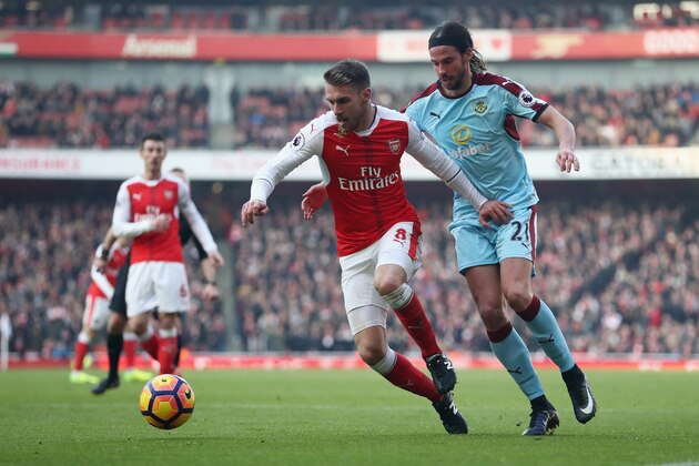 LONDON, ENGLAND - JANUARY 22:  Aaron Ramsey of Arsenal and George Boyd of Burnley compete for the ball during the Premier League match between Arsenal and Burnley at the Emirates Stadium on January 22, 2017 in London, England.  (Photo by Julian Finney/Getty Images)