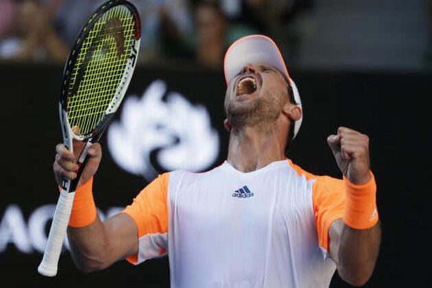 Germany's Mischa Zverev celebrates his victory over Britain's Andy Murray during their fourth round match at the Australian Open tennis championships in Melbourne, Australia, Sunday, Jan. 22, 2017. (AP Photo/Aaron Favila)