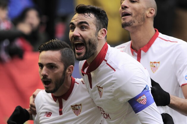 Sevilla's midfielder Vicente Iborra (R) and midfielder Pablo Sarabia (L) celebrate after their team's third goal during the Spanish league football match CA Osasuna vs Sevilla FC at El Sadar stadium in Pamplona on January 22, 2017. / AFP / ANDER GILLENEA        (Photo credit should read ANDER GILLENEA/AFP/Getty Images)