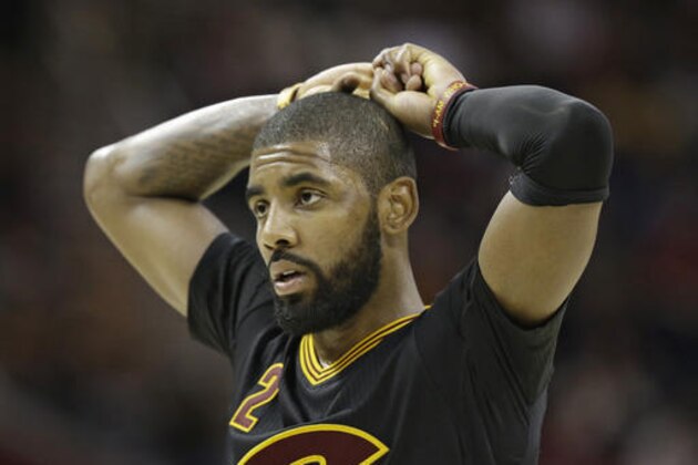 Cleveland Cavaliers' Kyrie Irving reacts in the second half of an NBA basketball game against the San Antonio Spurs, Saturday, Jan. 21, 2017, in Cleveland. (AP Photo/Tony Dejak)