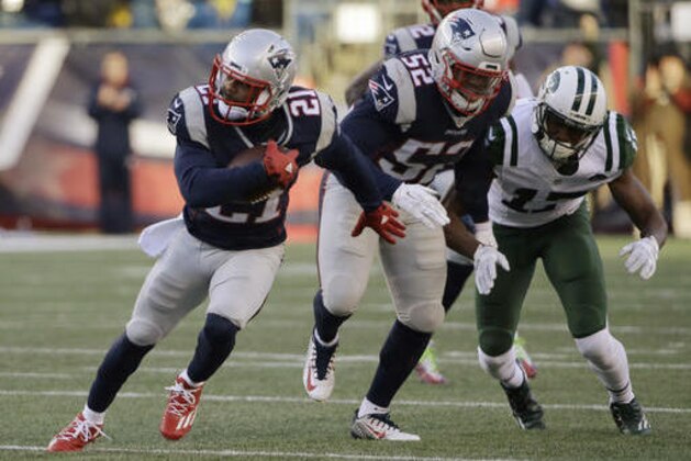 New England Patriots cornerback Malcolm Butler (21) runs with the ball after intercepting a pass intended for New York Jets wide receiver Charone Peake (17) during the second half of an NFL football game, Saturday, Dec. 24, 2016, in Foxborough, Mass. (AP Photo/Elise Amendola)