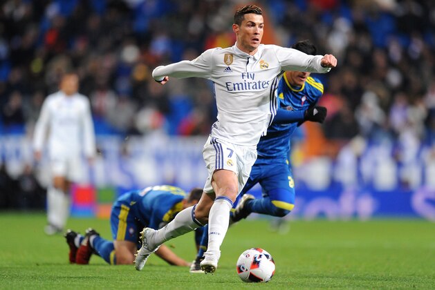 MADRID, SPAIN - JANUARY 18: Cristiano Ronaldo of Real Madrid in action against Facundo Roncaglia of Celta de Vigo during the Copa del Rey Quarter Final, First Leg match between Real Madrid CF and Celta Vigo at Bernabeu on January 18, 2017 in Madrid, Spain. (Photo by Denis Doyle/Getty Images) MADRID, SPAIN - JANUARY 18: Cristiano Ronaldo of Real Madrid in action against Facundo Roncaglia of Celta de Vigo during the Copa del Rey Quarter Final, First Leg match between Real Madrid CF and Celta Vigo at Bernabeu on January 18, 2017 in Madrid, Spain. (Photo by Denis Doyle/Getty Images)
