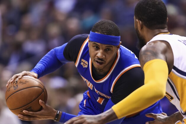 INDIANAPOLIS, IN - JANUARY 23: Carmelo Anthony #7 of the New York Knicks holds the ball against Paul George #13 of the Indiana Pacers at Bankers Life Fieldhouse on January 23, 2017 in Indianapolis, Indiana. NOTE TO USER: User expressly acknowledges and agrees that, by downloading and/or using this photograph, user is consenting to the terms and conditions of the Getty Images License Agreement. Mandatory Copyright Notice: Copyright 2017 NBAE (Photo by Michael Hickey/Getty Images)