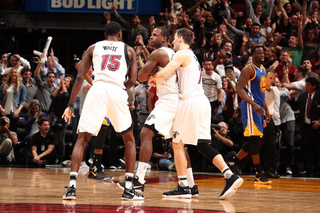 MIAMI, FL - JANUARY 23: Dion Waiters #11 of the Miami Heat celebrates with his team after making the game winning shot during the game against the Golden State Warriors on January 23, 2017 at American Airlines Arena in Miami, Florida. NOTE TO USER: User expressly acknowledges and agrees that, by downloading and or using this Photograph, user is consenting to the terms and conditions of the Getty Images License Agreement. Mandatory Copyright Notice: Copyright 2017 NBAE (Photo by Issac Baldizon/NBAE via Getty Images)