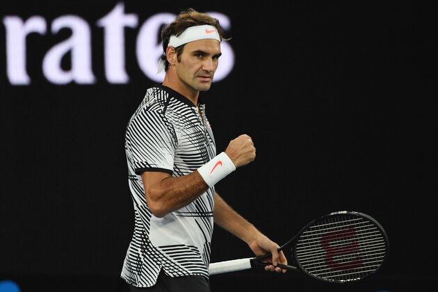 Switzerland's Roger Federer reacts after a point against Germany's Mischa Zverev during their men's singles quarter-final match on day nine of the Australian Open tennis tournament in Melbourne on January 24, 2017. / AFP / SAEED KHAN / IMAGE RESTRICTED TO EDITORIAL USE - STRICTLY NO COMMERCIAL USE        (Photo credit should read SAEED KHAN/AFP/Getty Images)