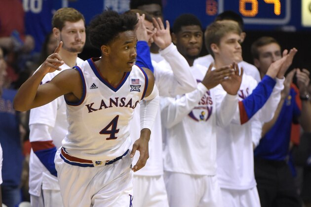 LAWRENCE, KS - JANUARY 21: Devonte' Graham #4 of the Kansas Jayhawks celebrates a three point shot against the Texas Longhorns in the second half at Allen Field House on January 21, 2017 in Lawrence, Kansas. (Photo by Ed Zurga/Getty Images)