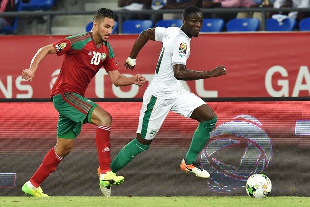 Morocco's forward Aziz Bouhaddouz (L) challenges Ivory Coast's defender Eric Bailly during the 2017 Africa Cup of Nations group C football match between Morocco and Ivory Coast in Oyem on January 24, 2017. / AFP / ISSOUF SANOGO        (Photo credit should read ISSOUF SANOGO/AFP/Getty Images)