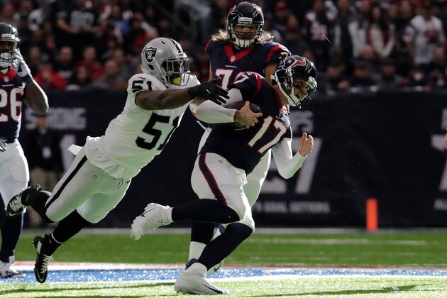 HOUSTON, TX - JANUARY 07:  Bruce Irvin #51 of the Oakland Raiders tackles Brock Osweiler #17 of the Houston Texans during the first quarter of their AFC Wild Card game at NRG Stadium on January 7, 2017 in Houston, Texas.  (Photo by Tim Warner/Getty Images)