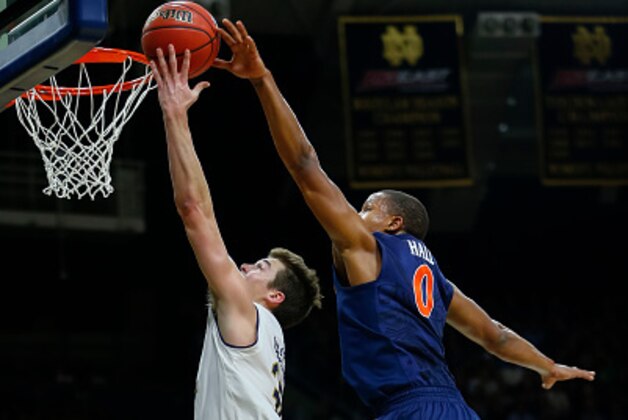 SOUTH BEND, IN - JANUARY 24:  Steve Vasturia #32 of the Notre Dame Fighting Irish shoots the ball against Devon Hall #0 of the Virginia Cavaliers at Purcell Pavilion on January 24, 2017 in South Bend, Indiana.  (Photo by Michael Hickey/Getty Images)