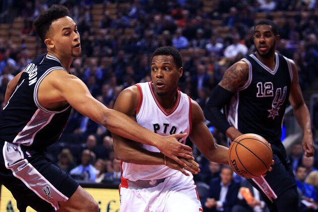 TORONTO, ON - JANUARY 24:  Kyle Lowry #7 of the Toronto Raptors dribbles the ball as Kyle Anderson #1 of the San Antonio Spurs defends during the first half of an NBA game at Air Canada Centre on January 24, 2017 in Toronto, Canada.  NOTE TO USER: User expressly acknowledges and agrees that, by downloading and or using this photograph, User is consenting to the terms and conditions of the Getty Images License Agreement.  (Photo by Vaughn Ridley/Getty Images)