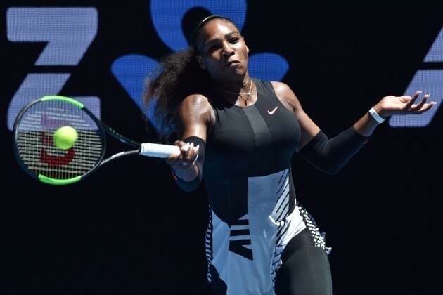 Serena Williams of the US hits a return against Britain's Johanna Konta during their women's singles quarter-final match on day ten of the Australian Open tennis tournament in Melbourne on January 25, 2017. / AFP / PAUL CROCK / IMAGE RESTRICTED TO EDITORIAL USE - STRICTLY NO COMMERCIAL USE        (Photo credit should read PAUL CROCK/AFP/Getty Images)